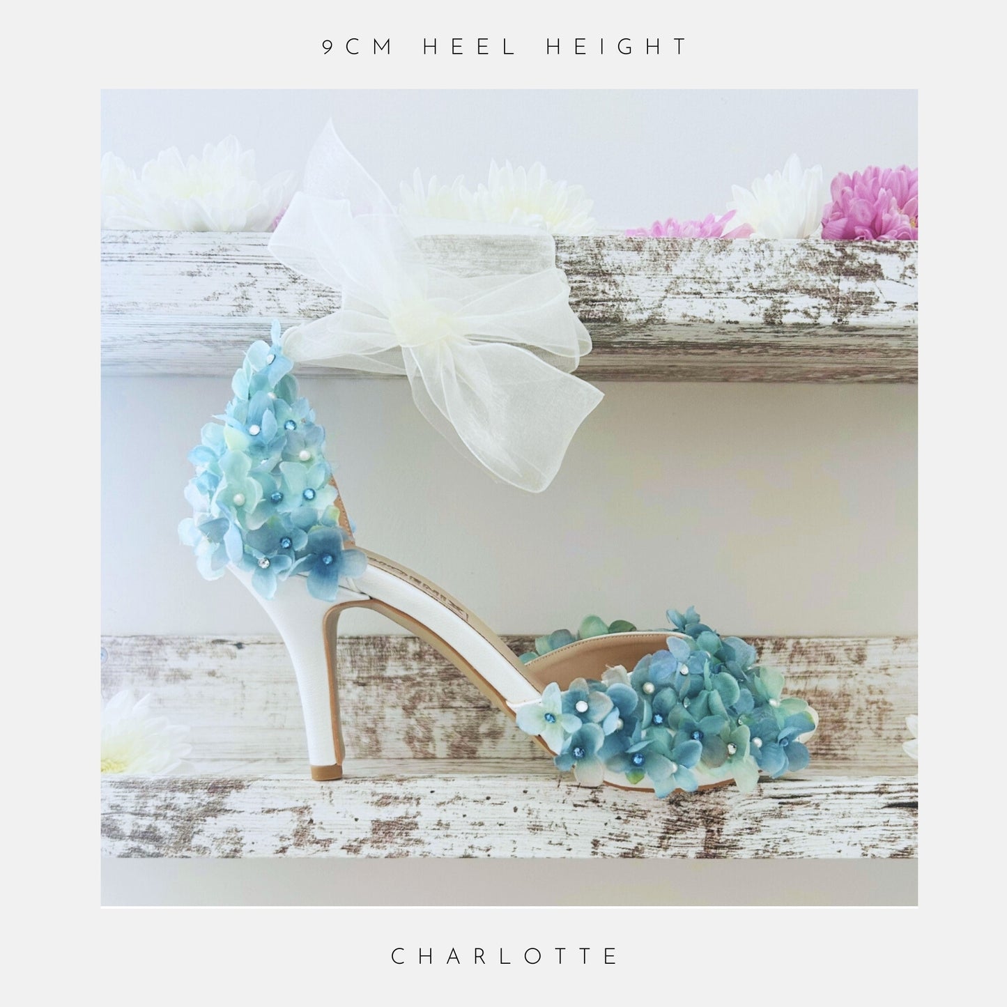 High-heeled shoe with floral design on a wooden surface, featuring the name 'Charlotte'.