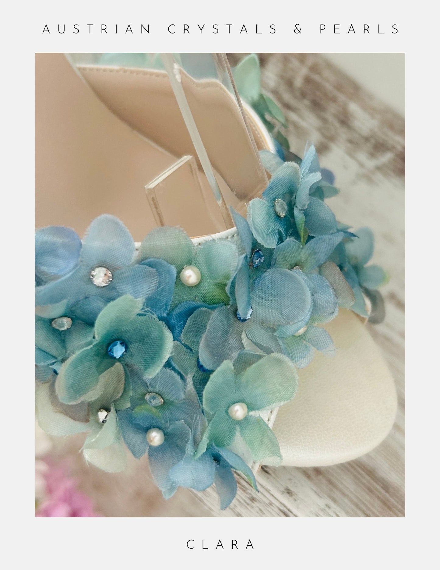 Blue floral peep toe bridal shoe with pearls on a white background, labelled 'Austrian Crystals & Pearls' and 'Clara'.