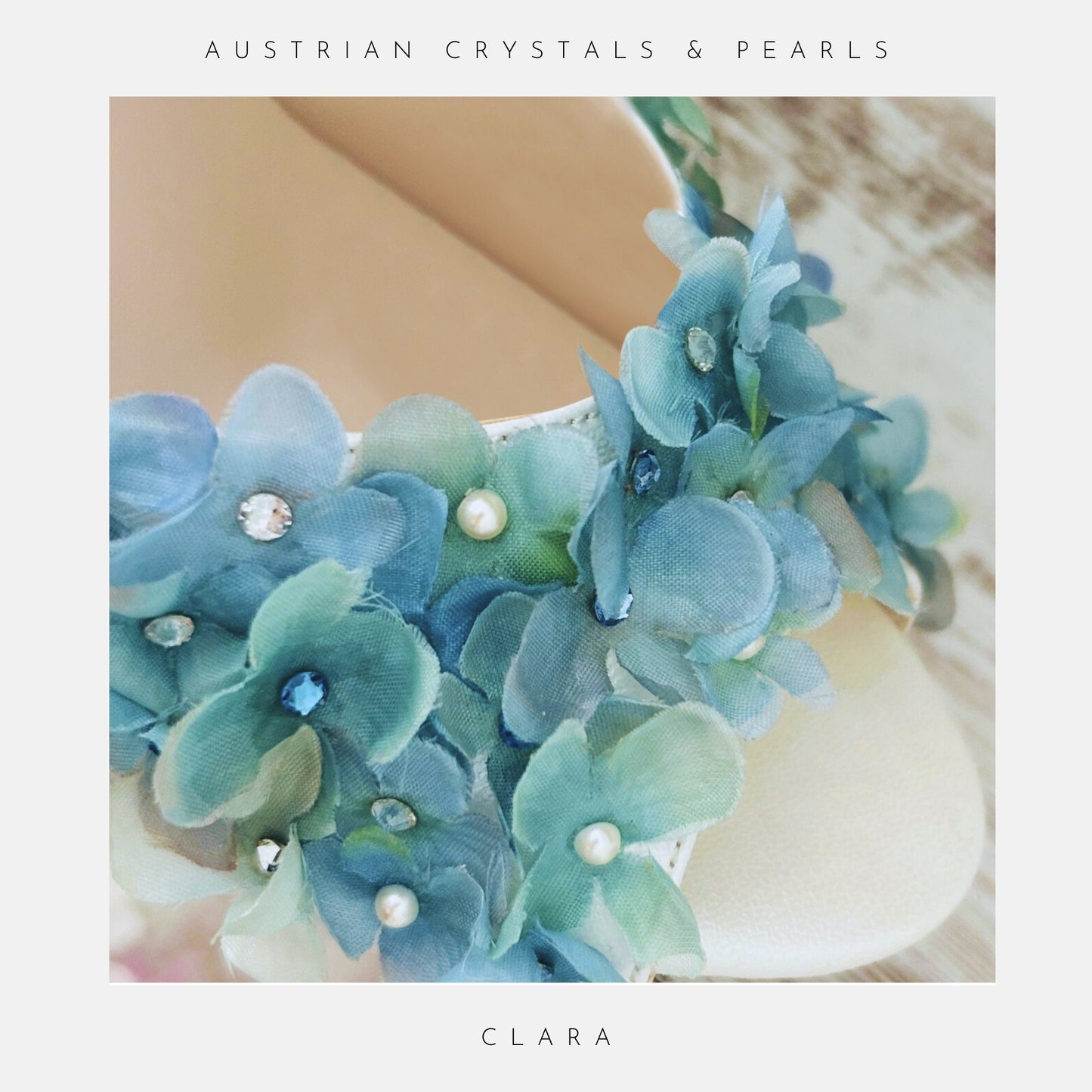 Blue floral peep toe bridal shoe with pearls on a white background, labelled 'Austrian Crystals & Pearls' and 'Clara'.