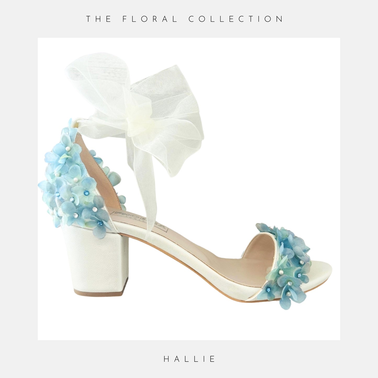 Ivory bridal sandal with floral decorations on a light grey background