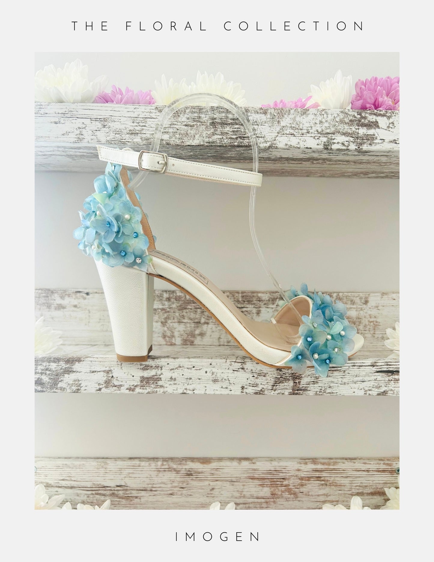Ivory block heel bridal sandal with blue floral decorations on a wooden surface, labelled 'The Floral Collection' by Imogen.