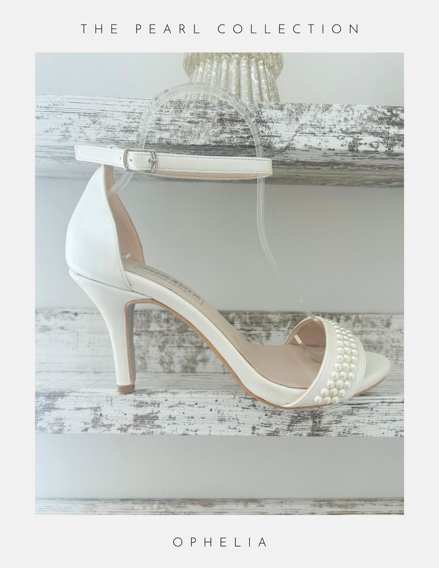 Ivory high-heeled open toe wedding shoes with pearl embellishments on a wooden surface, labelled 'The Pearl Collection'.