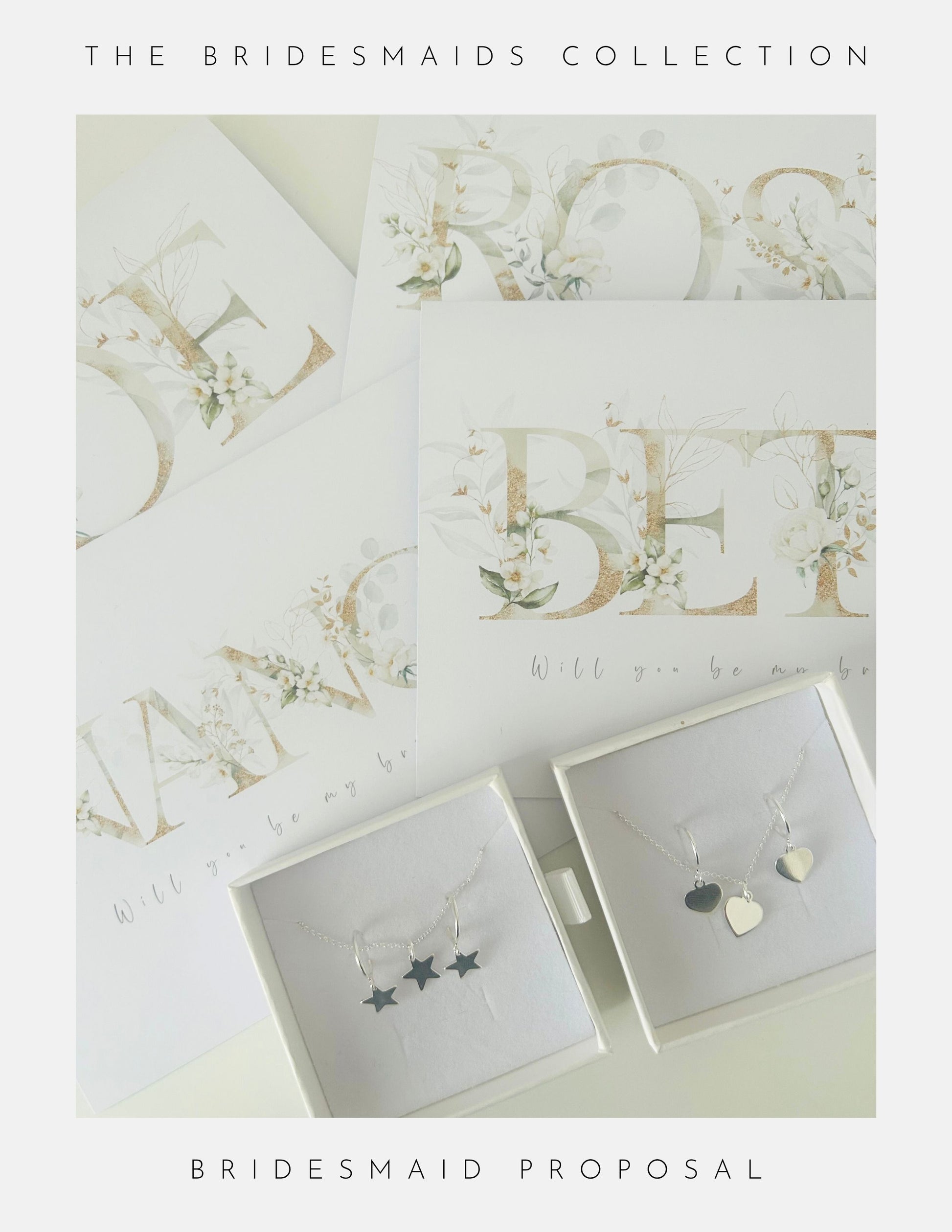 Flat lay of Phoenix England Be My Bridesmaid Gifts: proposal cards with floral lettering, next to two white sterling silver jewellery boxes—one with three star charms, the other with two heart charms.