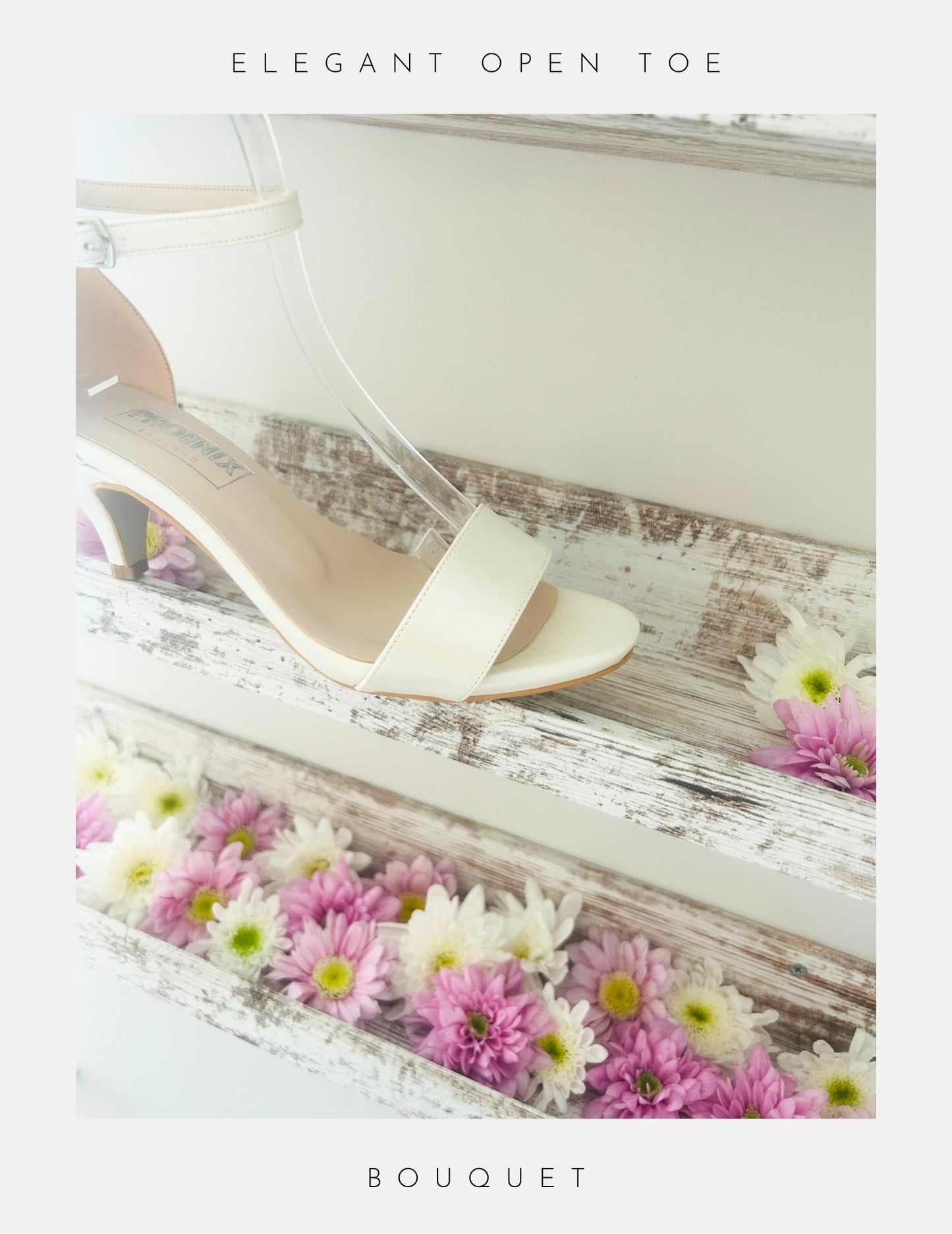 Ivory sandal with open toe on a wooden surface with flowers