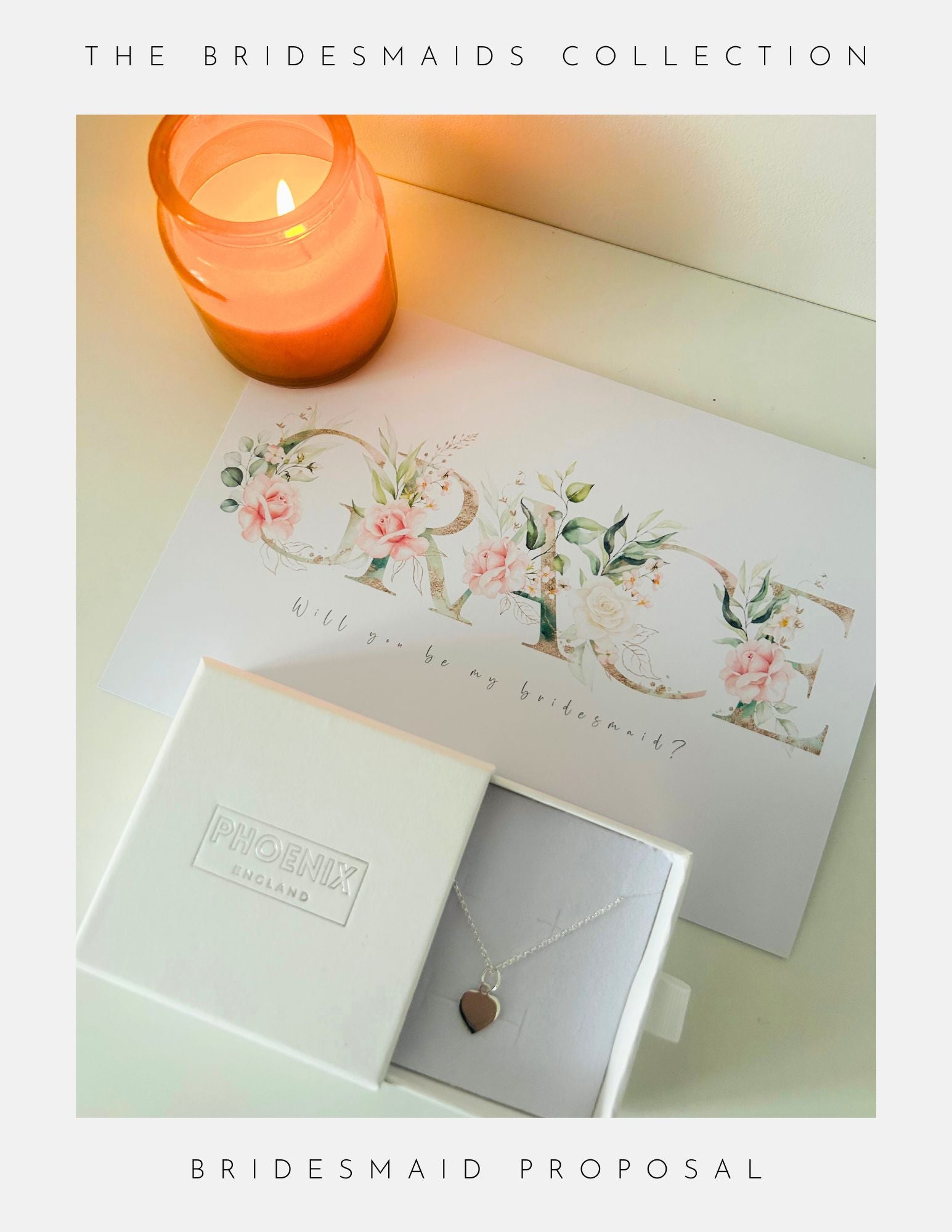 A lit candle, a floral Grace, Will you be my bridesmaid? card, and an open box with a sterling silver heart pendant necklace by Phoenix England are arranged on white. Text reads: Bridesmaids Proposal Ideas Sterling Silver Collection.