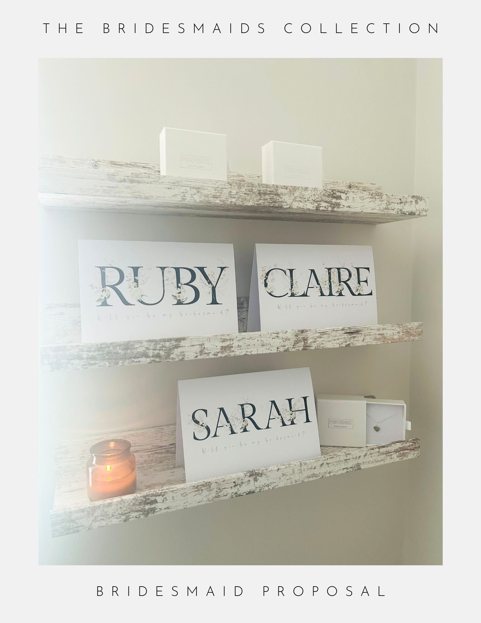 Three rustic shelves hold white boxes and Phoenix England Bridesmaids Proposal Cards labeled RUBY, CLAIRE, SARAH with Will you be my bridesmaid? A lit candle glows below, creating a softly lit scene perfect for gifting sterling silver jewelry.