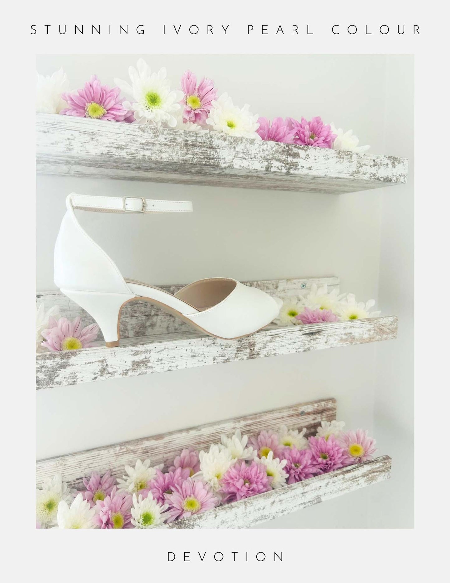 The image shows Phoenix England’s Devotion Peep Toe Kitten Heel Bridal Shoes in pearl ivory vegan leather on rustic white shelves with pink, white, and yellow flowers. Stunning Ivory Pearl Colour is at the top and Devotion at the bottom.