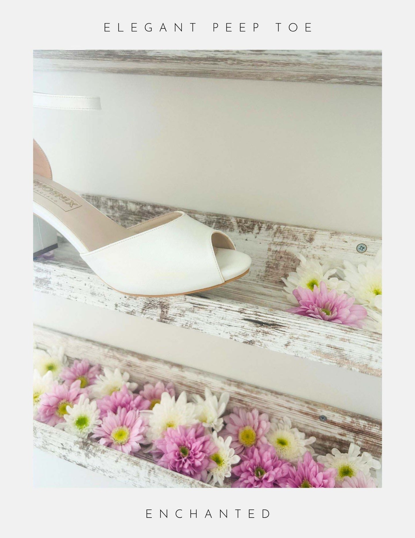 The Enchanted Peep Toe Low Bridal Shoes from Phoenix England, crafted in pearl ivory vegan leather, sit on top of a rustic wooden shelf with pink and white flowers.