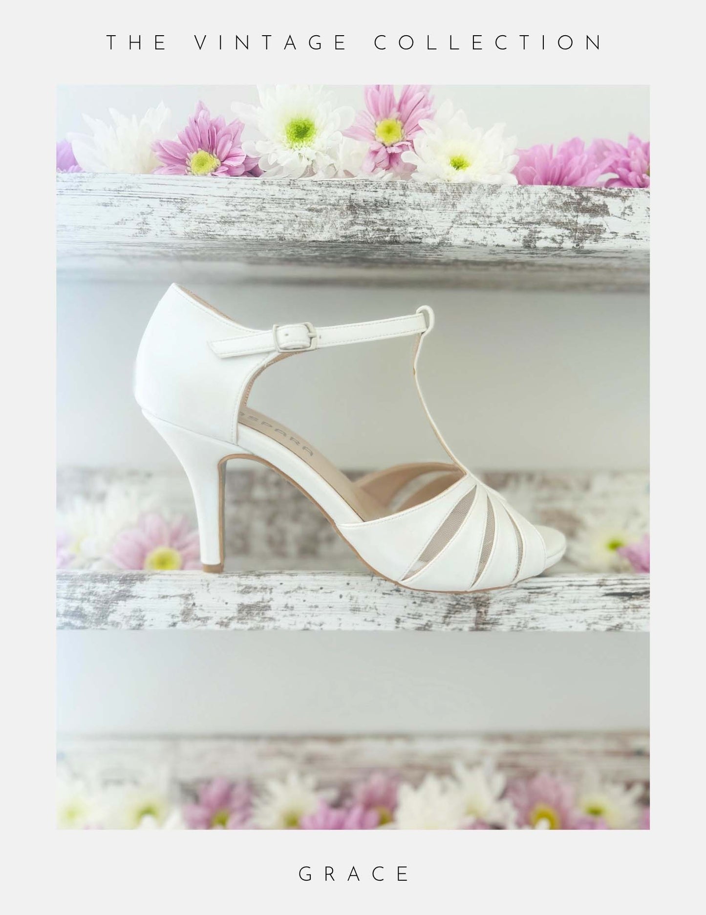 Ivory vintage inspired high-heeled shoe with floral decorations on a white surface