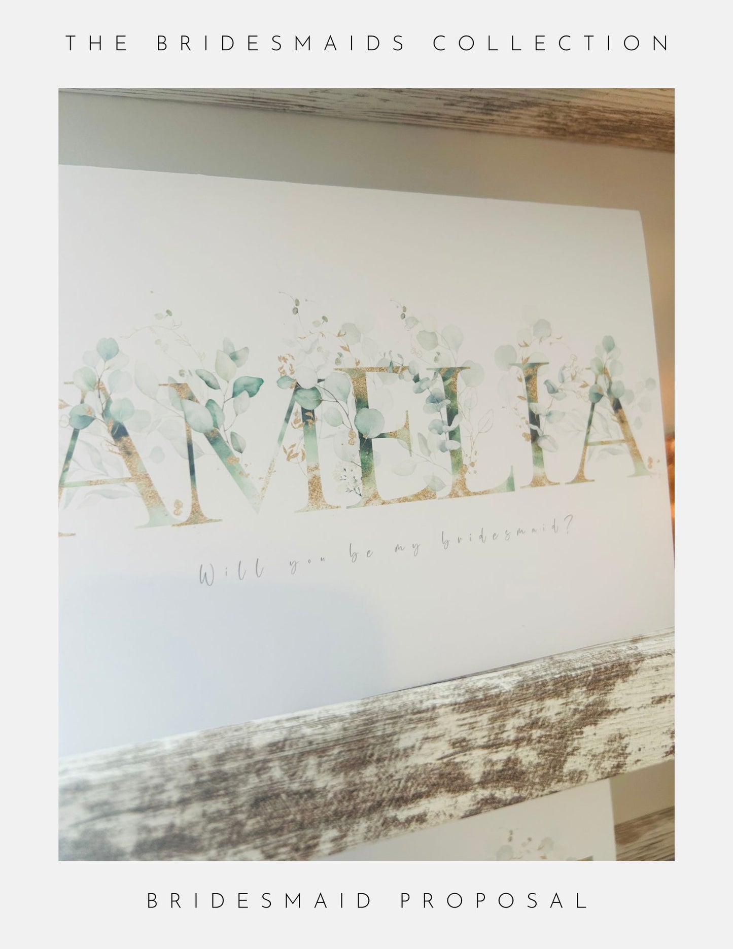 A card with elegant floral accents and AMELIA in bold letters, featuring “Will you be my bridesmaid?”—displayed on a rustic shelf. Perfect for the Maid Of Honour Proposal Sterling Silver by Phoenix England.