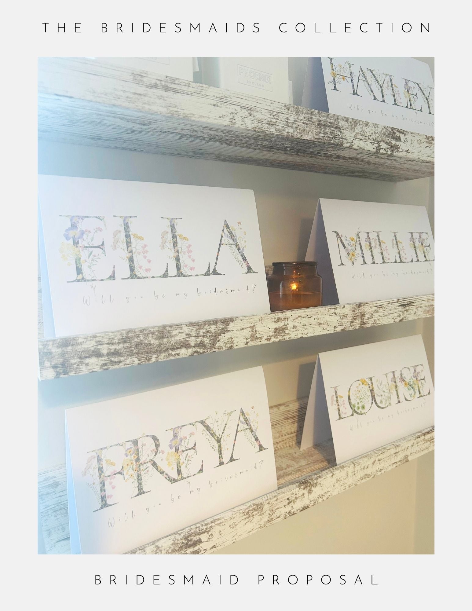 Three rustic shelves display folded cards with floral designs—Ella, Millie, Freya, Louise each saying “Will you be my bridesmaid?” A small candle sits between the cards. Phoenix England Thank You Bridesmaid Gift Ideas. Bridesmaids Collection Proposal.
