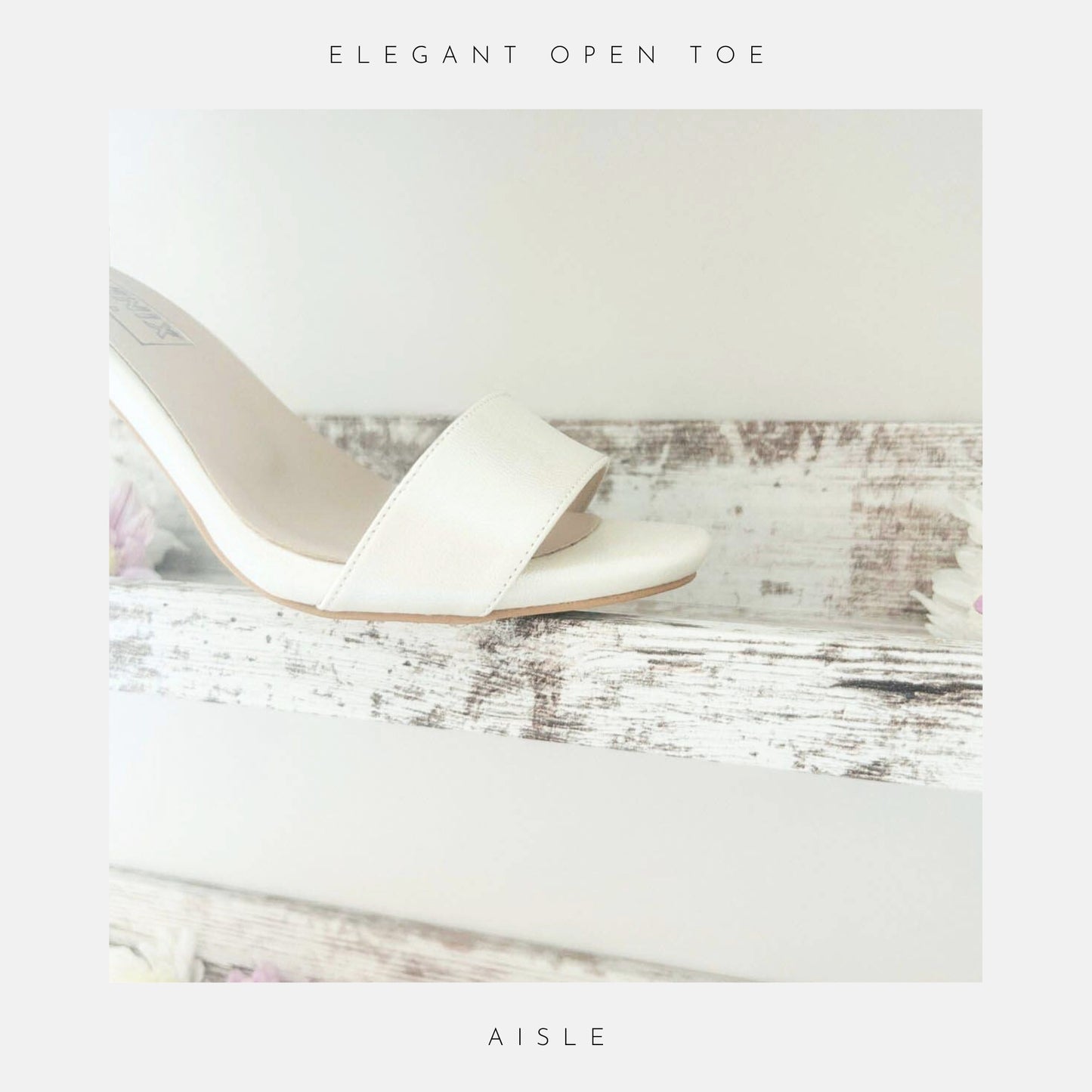 ivory wedding sandal with open toe on a wooden surface with flowers