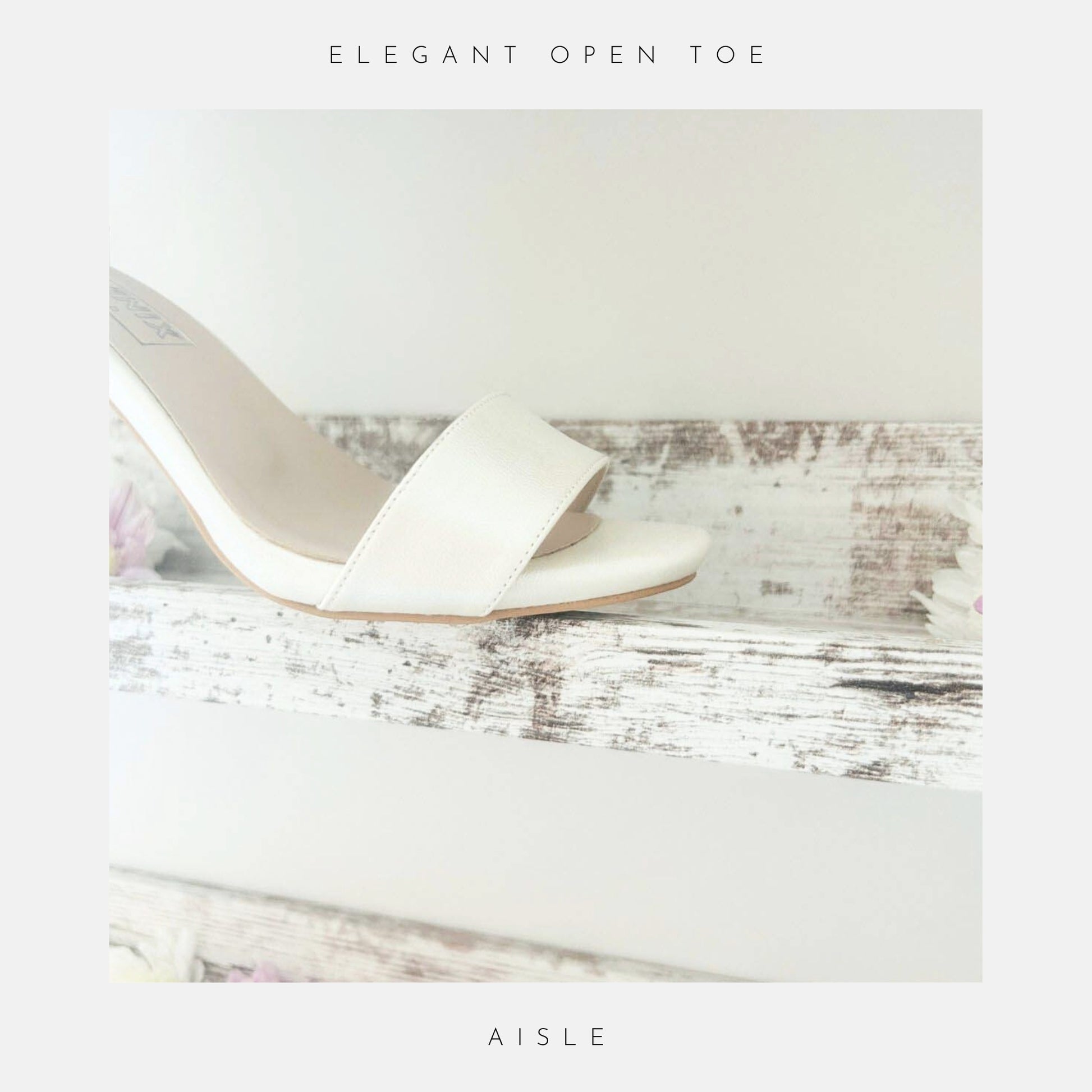 ivory wedding sandal with open toe on a wooden surface with flowers