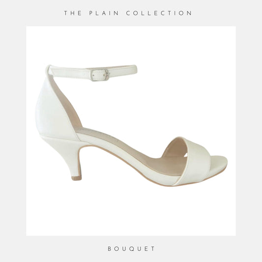 Ivory kitten heel bridal shoes with open toe and ankle strap shown on a white background with grey border.