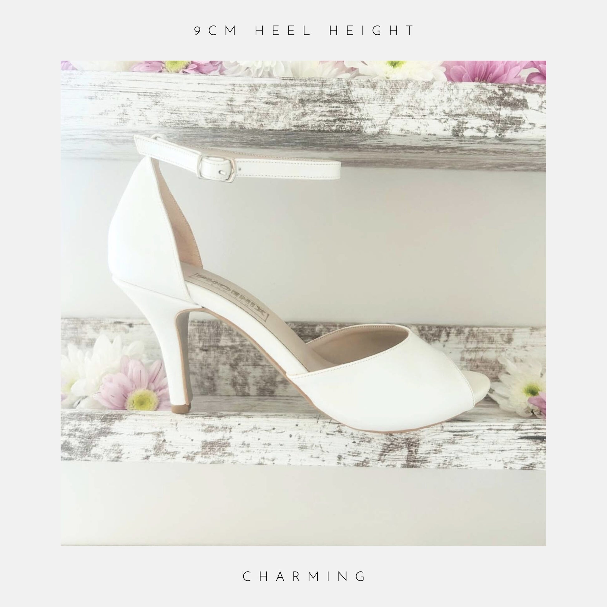 Ivory high-heeled peep toe bridal shoe on a wooden surface with flowers, labelled 'The Plain Collection'.