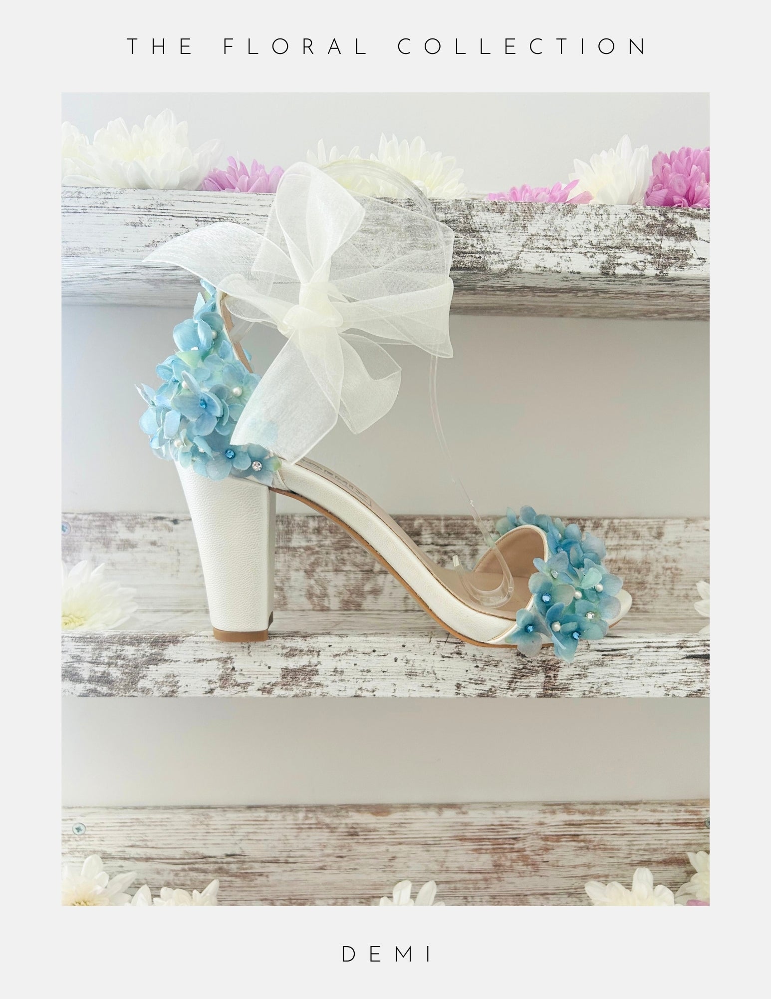 Ivory high-heeled block heel bridal shoes with floral decorations on a wooden surface, labelled 'The Floral Collection' DEMI.