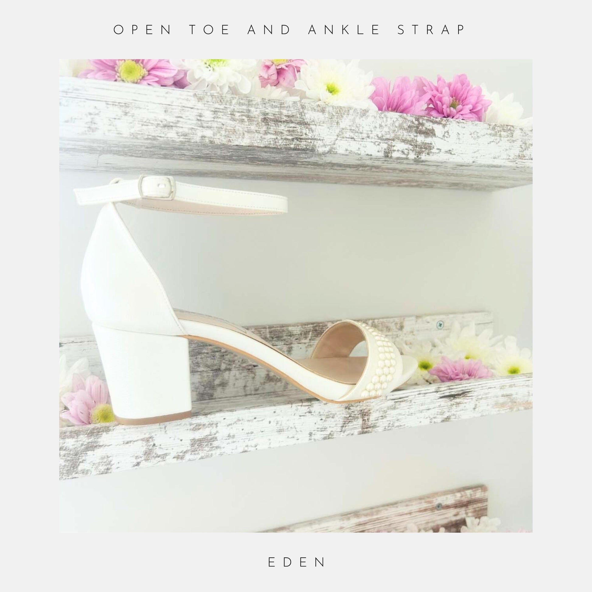 An ivory ankle-strap sandal with a pearl low block heel from Phoenix England’s Eden Pearl Low Block Heel Bridal Shoes rests on a rustic shelf adorned with daisies. Text above: Opn toe and ankle strap; below: Eden.