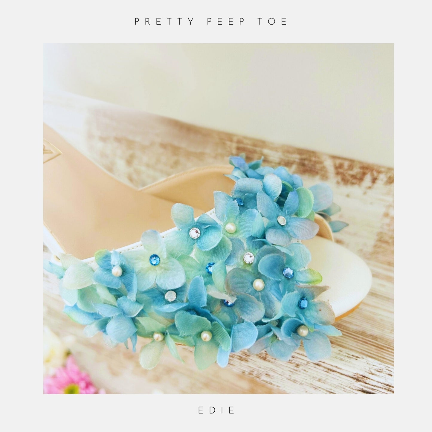 Blue floral peep toe bridal shoe with pearls on a white background, labelled 'Pretty Peep Toe' and 'EDIE'.