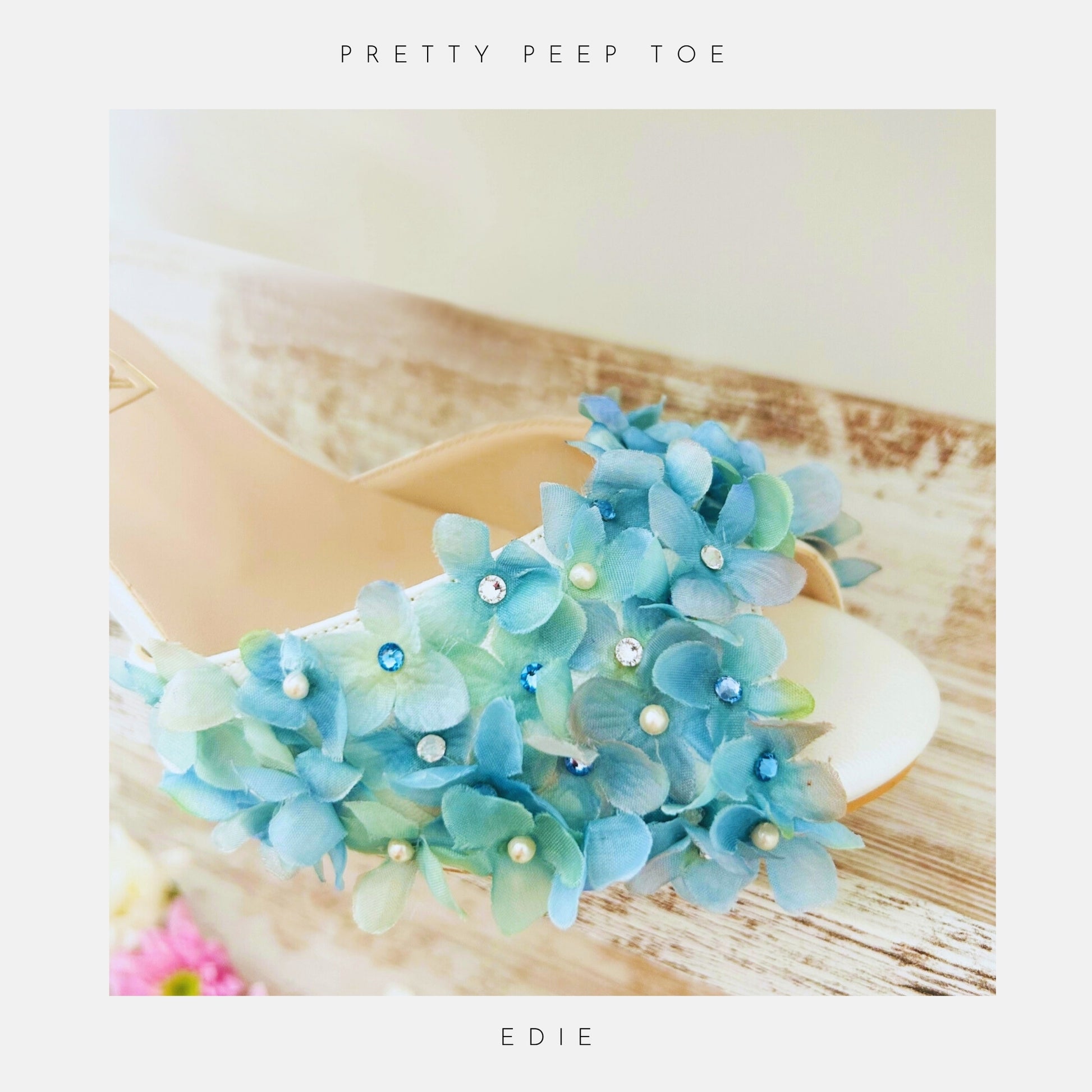 Blue floral peep toe bridal shoe with pearls on a white background, labelled 'Pretty Peep Toe' and 'EDIE'.