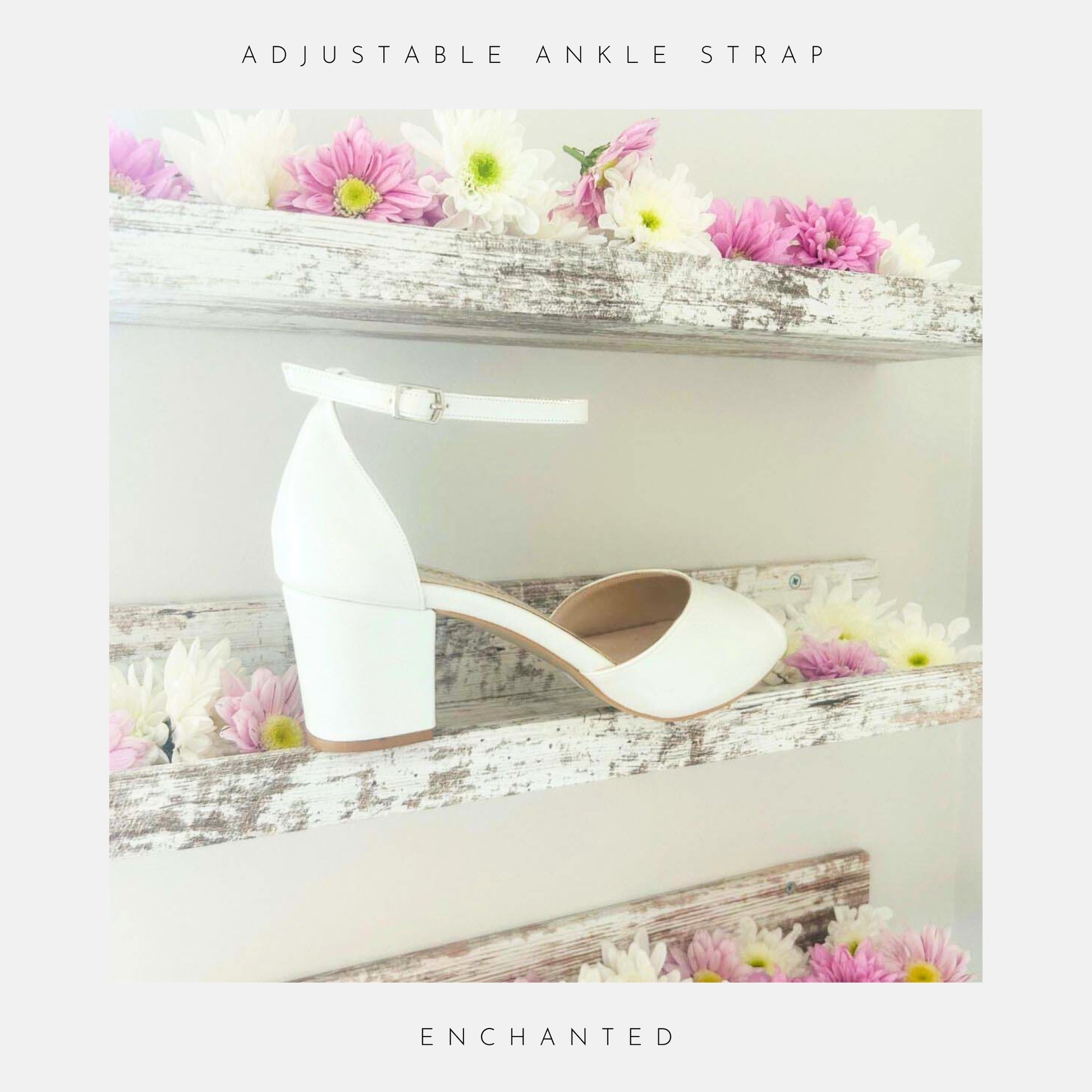The Phoenix England Enchanted Peep Toe Low Bridal Shoes in pearl ivory vegan leather feature a peep toe, ankle strap, and low heel, displayed on a rustic shelf with pink and white daisies. Text: Adjustable Ankle Strap, Enchanted.