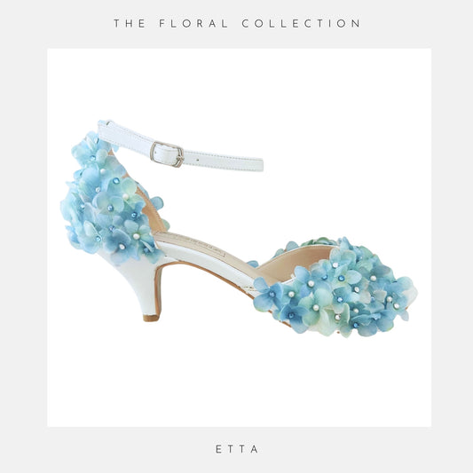 Kitten heel peep toe bridal shoe shown with pretty blue hydrangeas