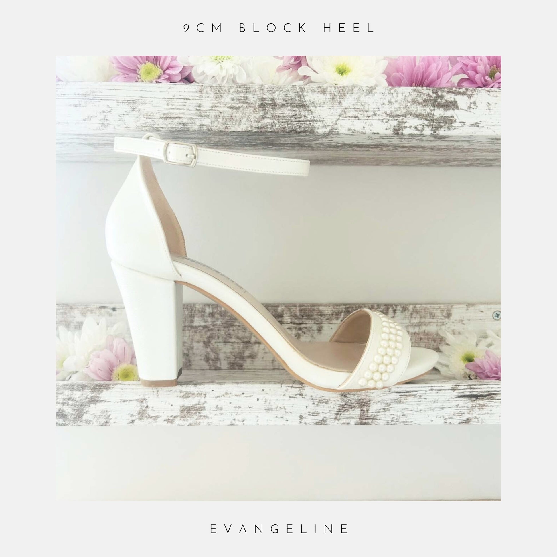 The Evangeline Pearl Block Heel Wedding Shoes by Phoenix England, elegant ivory sandals with ankle straps and pearl details, are shown on a rustic white wooden shelf adorned with pink and white flowers. Text reads: 9cm block heel and Evangeline.