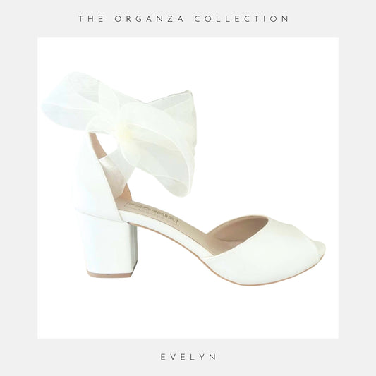 Ivory low block heel shoe with 'The Organza Collection' and 'Evelyn' text on a light grey background