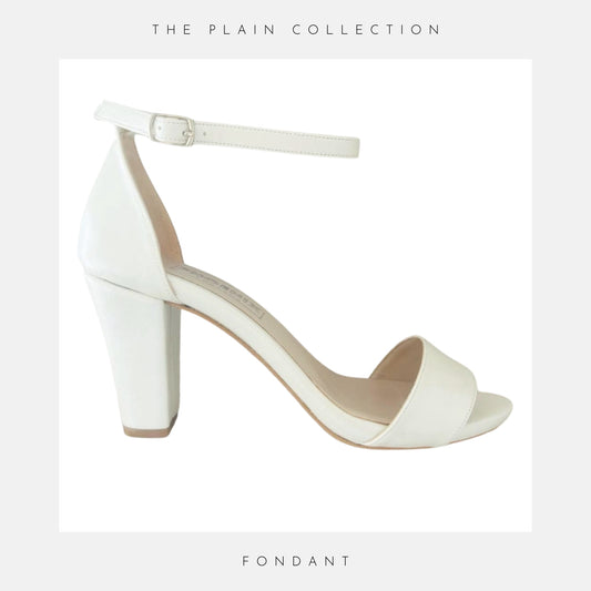 A single Callie Organza Strap High Block Bridal Shoe by Phoenix England, white with an ankle strap and open toe, is shown on a white background. The Plain Collection appears at the top, Fondant at the bottom. Perfect as block heel bridal shoes.