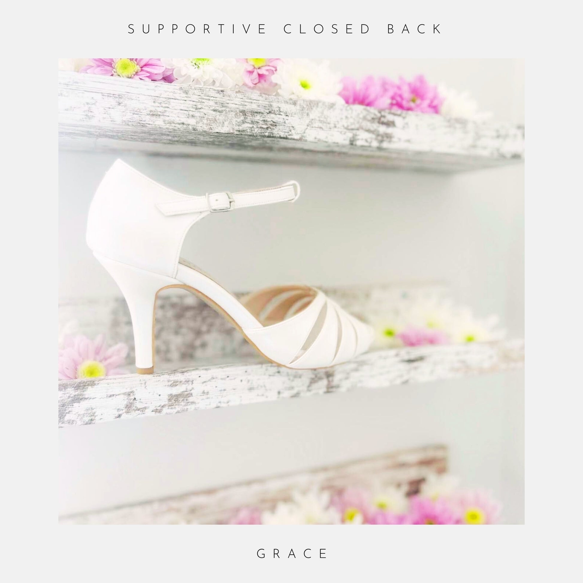 Ivory high-heeled bridal shoe on a decorative shelf with flowers