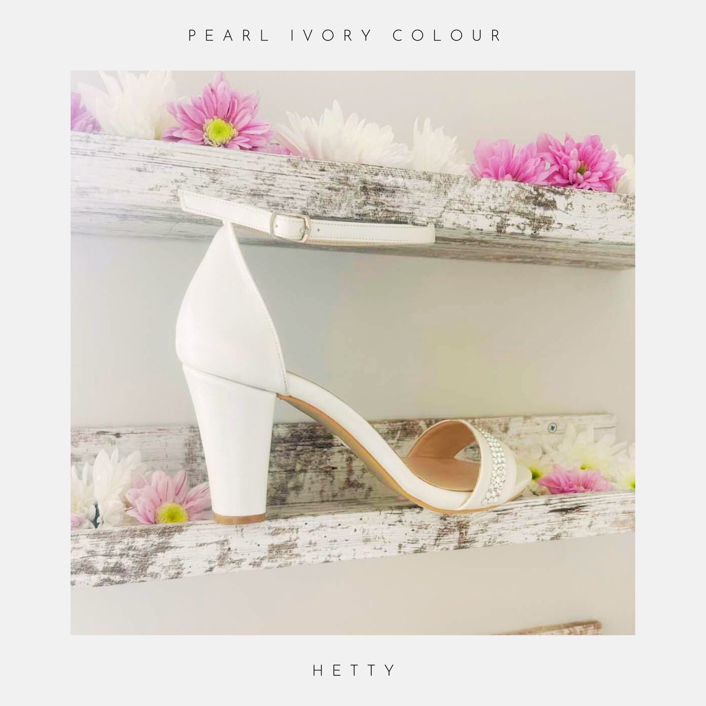Ivory bridal shoe shown with crystals and elegant high block heel and ankle strap