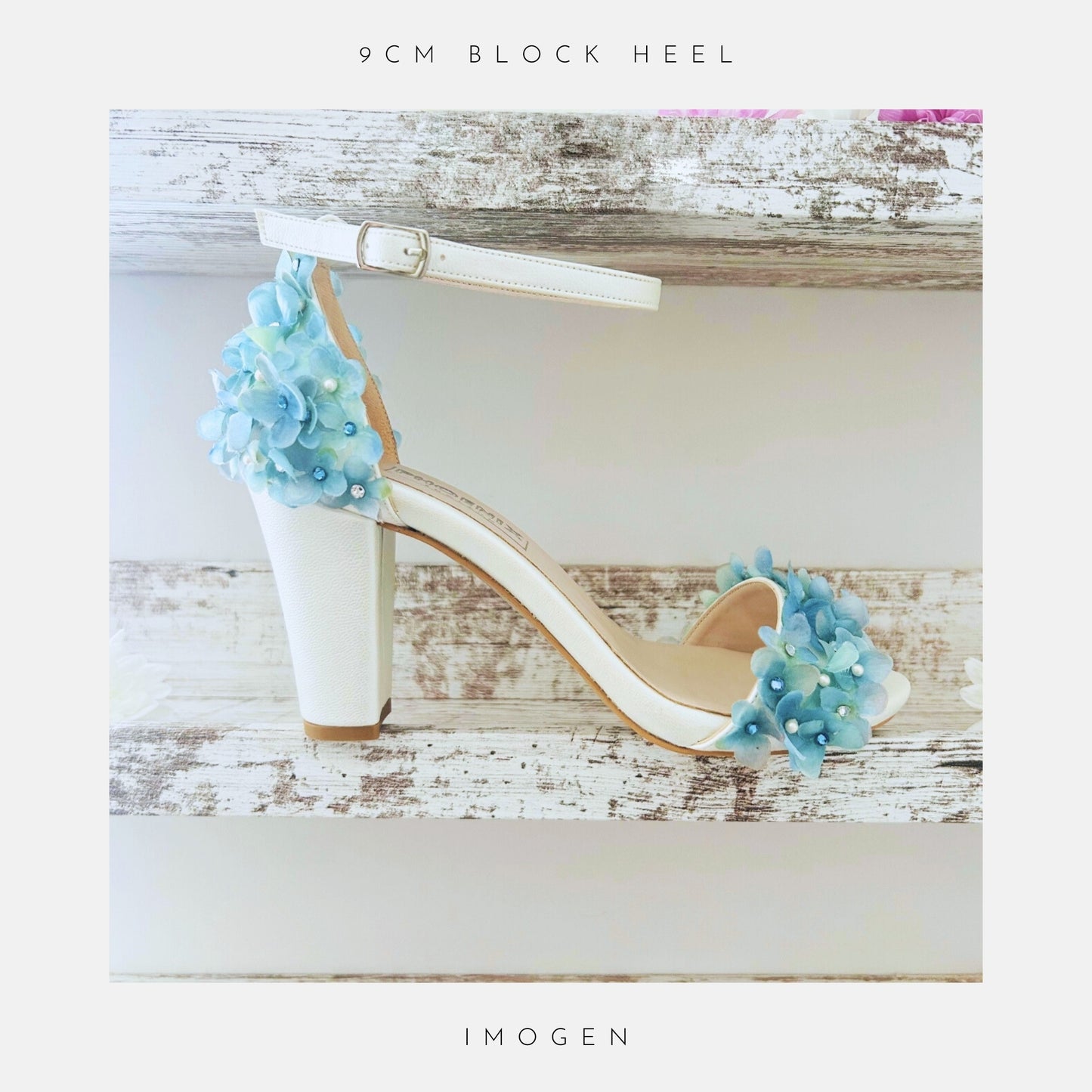 Ivory block heel bridal sandal with blue floral decorations on a wooden surface, labelled '9cm block heel' and Imogen.