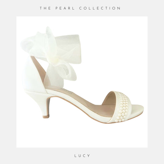 Pretty open toe with pearls and kitten shown with an organza ankle strap and on a white background with grey border and the text The Pearl Collection & Lucy