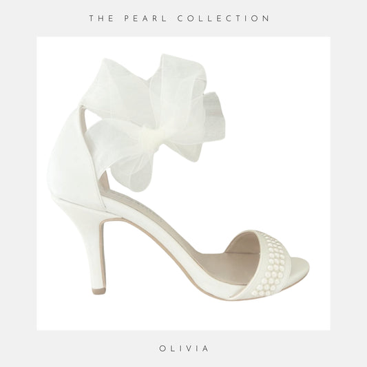 Beautiful Ivory pearl bridal shoes with high heel and organza strap.