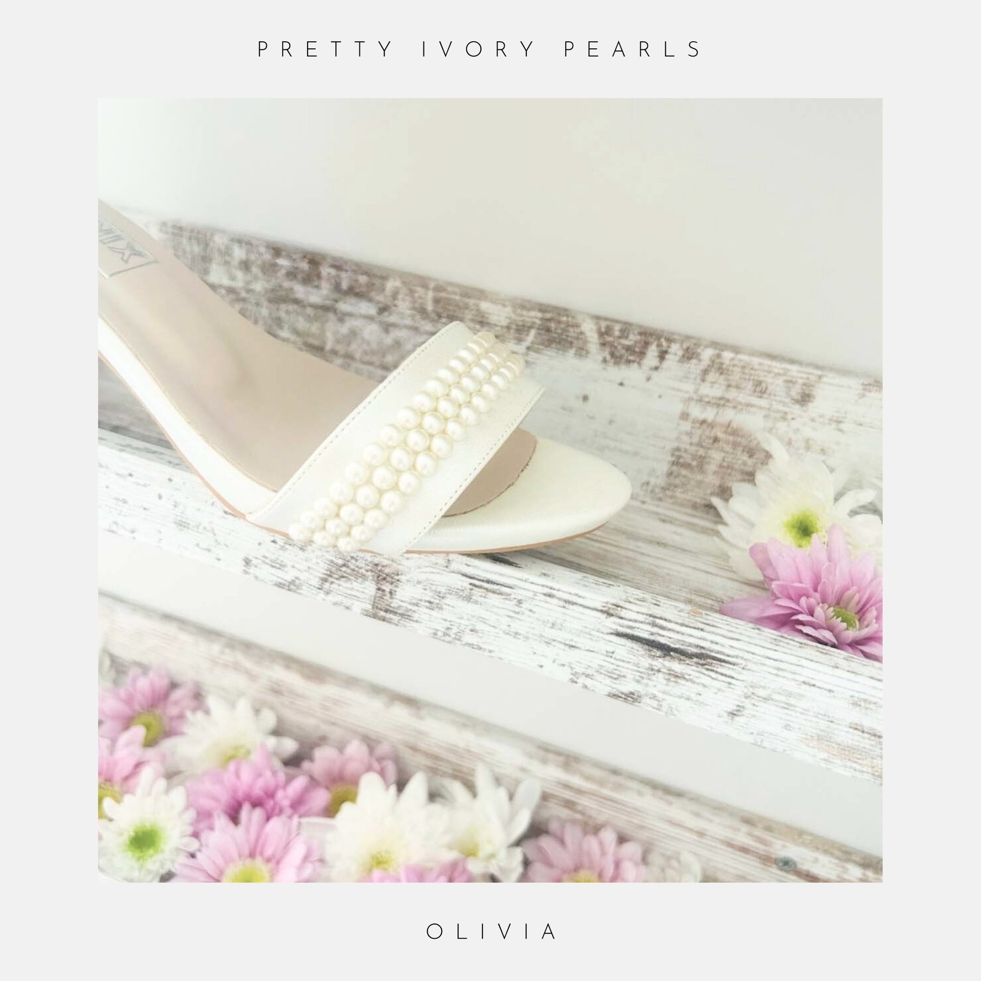 The Olivia Organza Strap Pearl Bridal Shoes by Phoenix England feature ivory leather, open toes, and rows of hand-applied pearls on the front straps, elegant wedding heels, beautifully displayed against a clean white background.