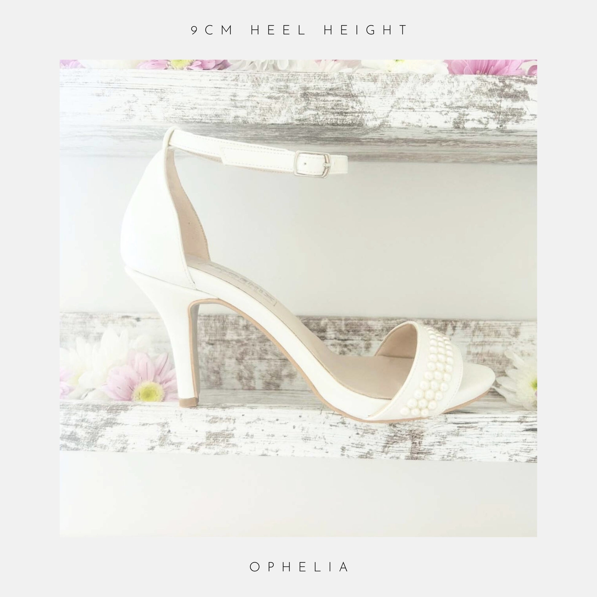 The Ophelia Pearl High Heel Wedding Shoes by Phoenix England are displayed on a rustic white shelf with pink and white daisies. Crystal pearls adorn the front strap. Text reads: 9cm heel height and Ophelia. Perfect bridal shoes.