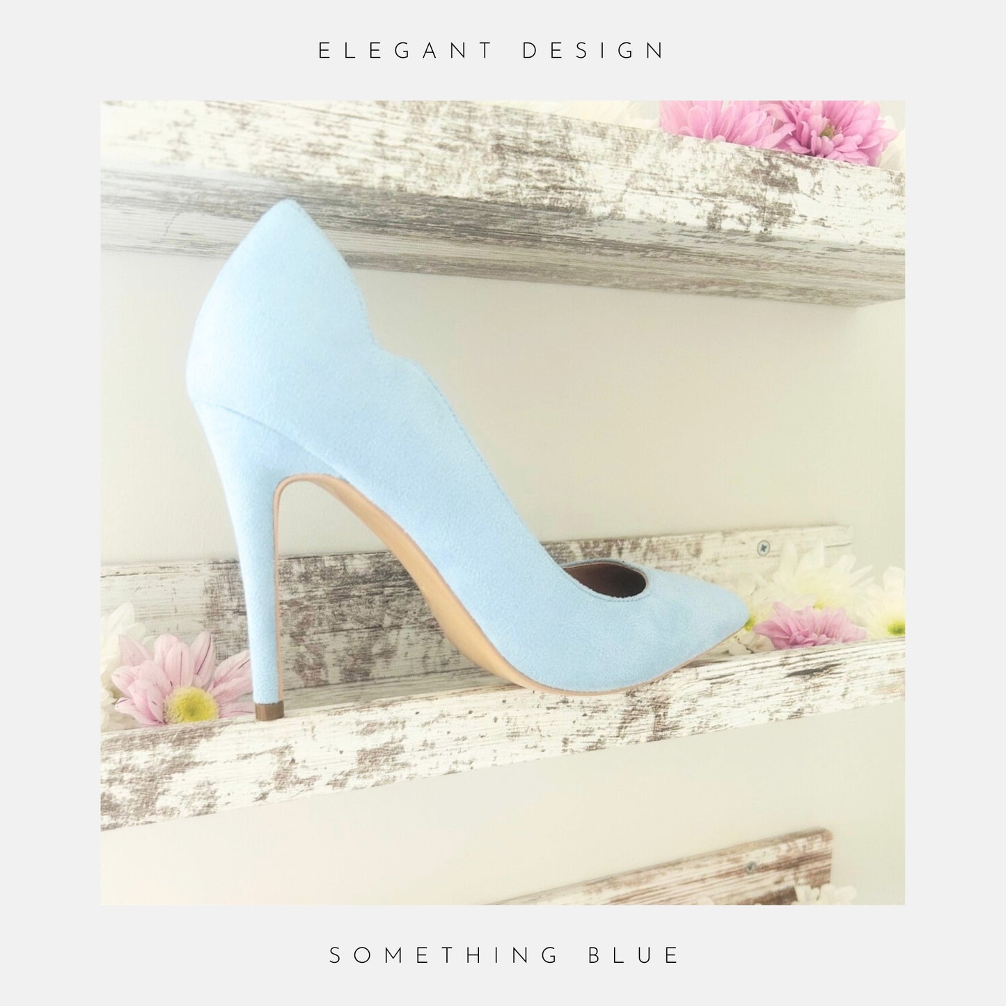 Blue faux suede high-heeled bridal shoe on a decorative wooden shelf with flowers.