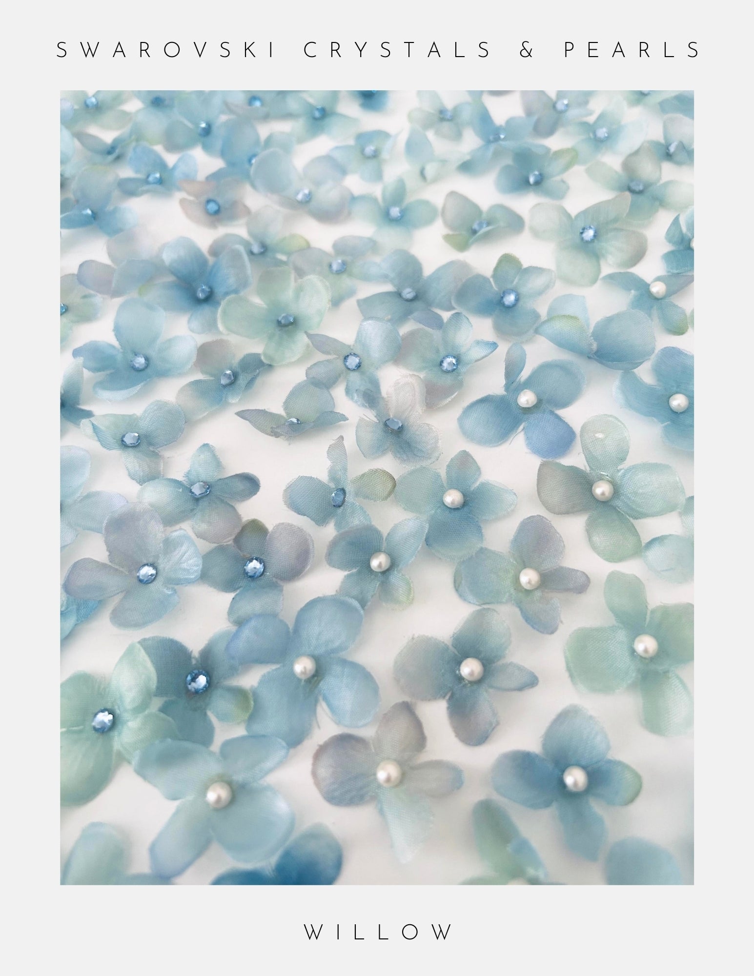 Blue floral decorations with Swarovski crystals and pearls on a white background