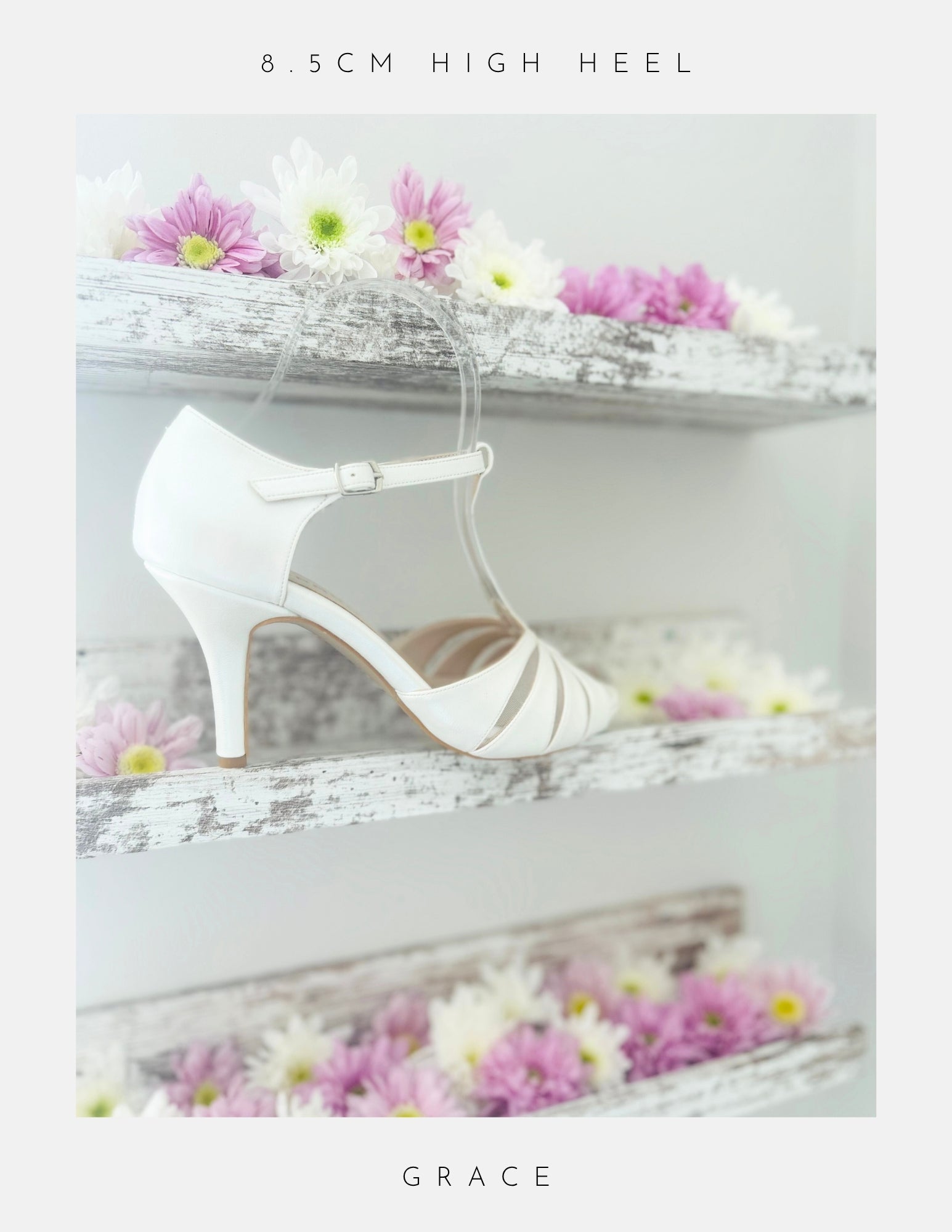 Ivory high-heeled bridal shoe with 'GRACE' branding on a decorative background with flowers.
