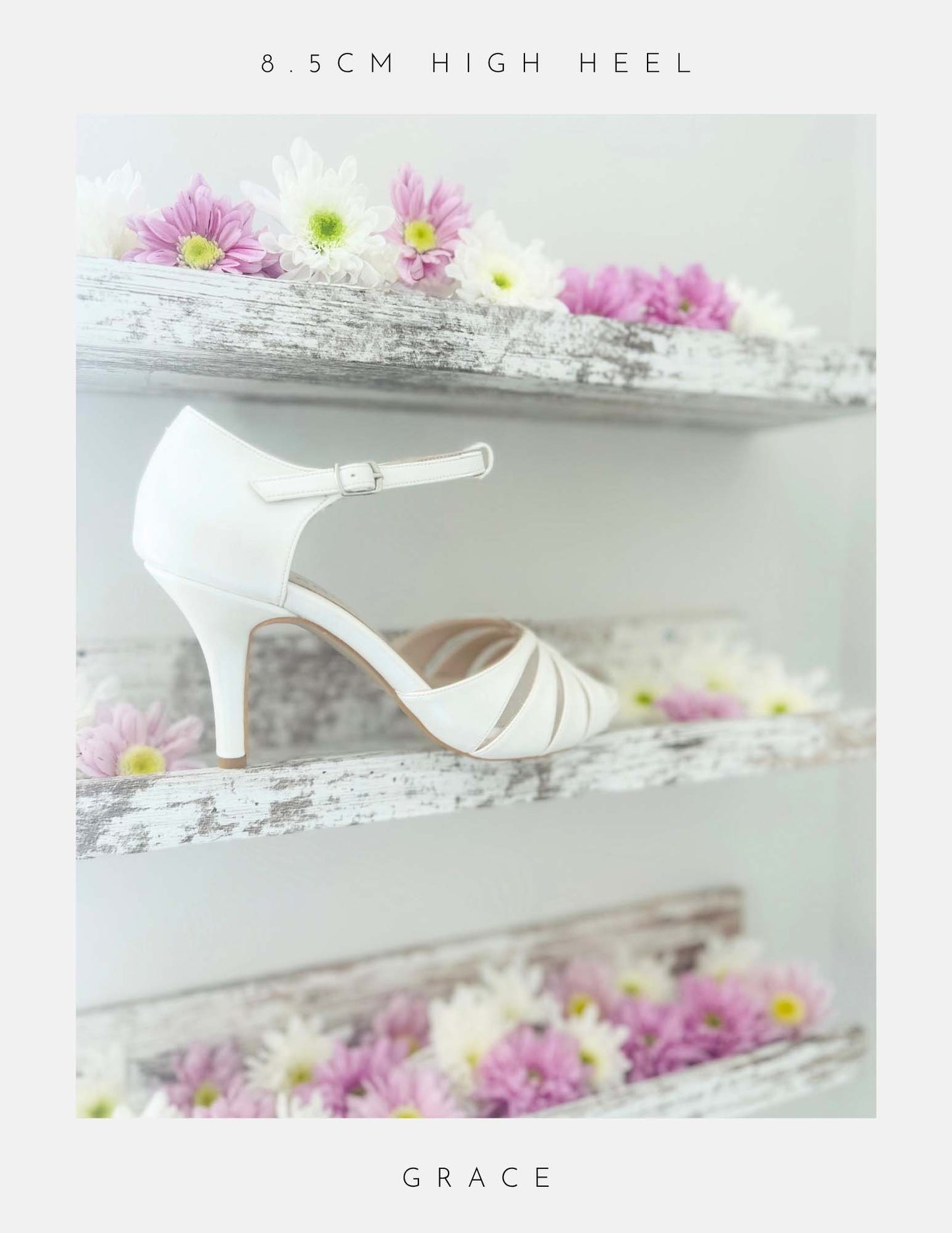 Ivory high-heeled bridal shoe on a decorative shelf with flowers