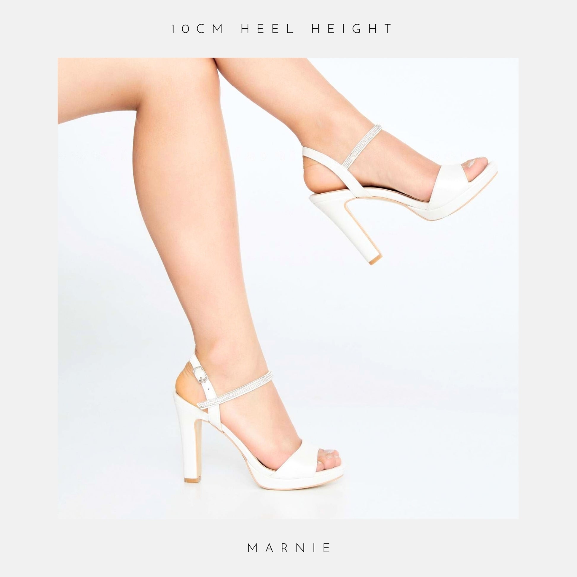 A pair of crossed legs in white Marnie Wedding Shoes by Phoenix England against a white background. Text above reads The Platform Collection; below: Marnie, perfect for your chic bridal look.