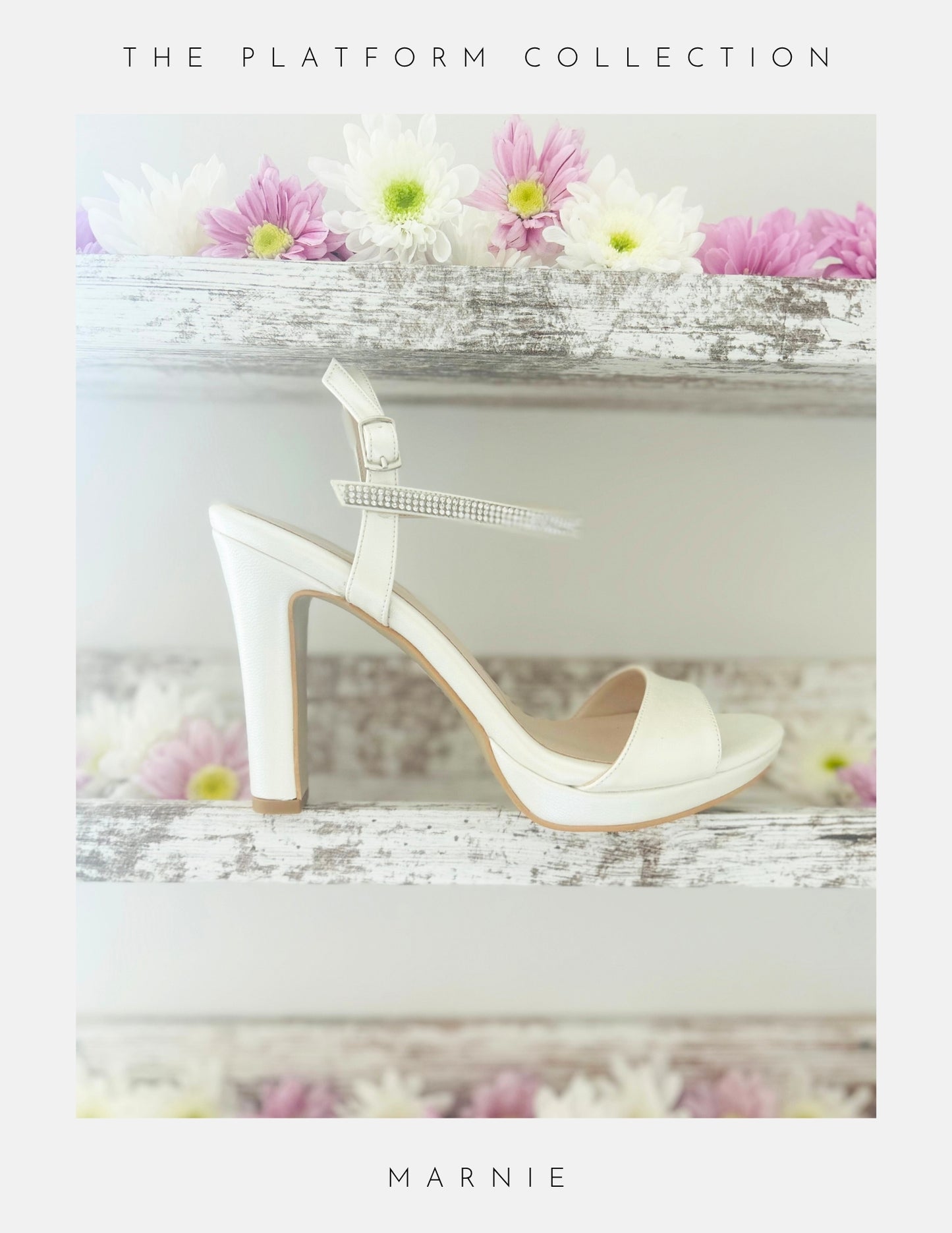 Ivory high-heeled bridal sandal with a platform on a decorative surface with flowers.