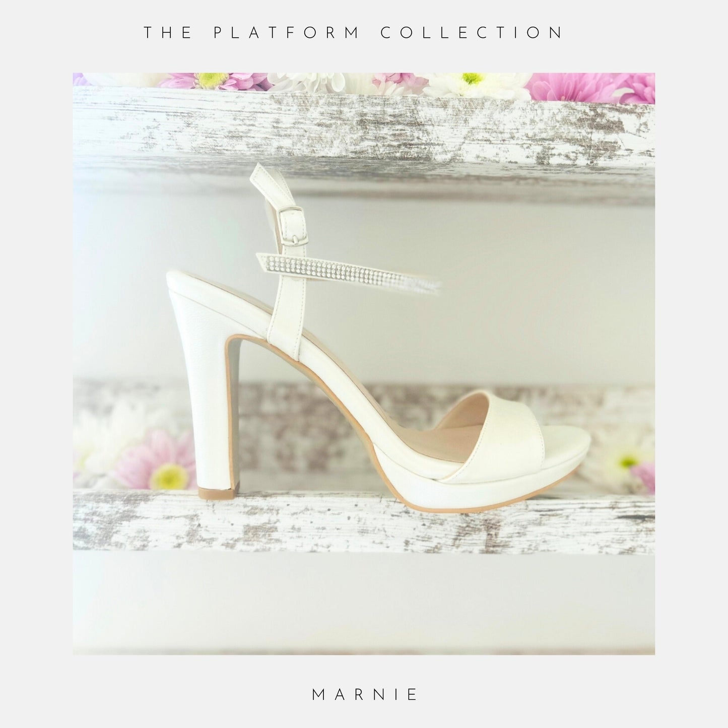 Ivory high-heeled bridal sandal with a platform on a decorative surface with flowers.