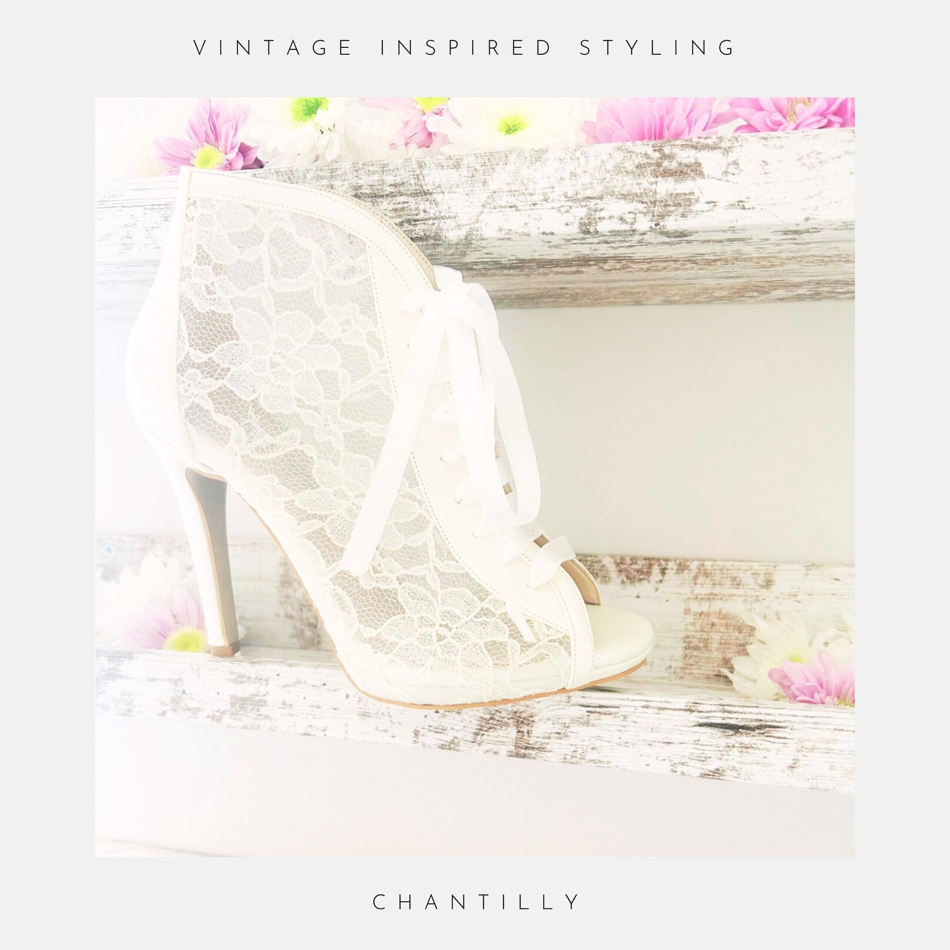 Ivory lace high-heeled wedding boots on a wooden surface with flowers, labelled 'Vintage Inspired Styling' and 'Chantilly'.